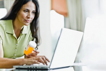 Woman Refilling Prescription Online --- Image by © Tim Pannell/Corbis