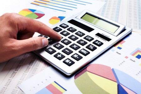 Hand with calculator. Finance and accounting business.
