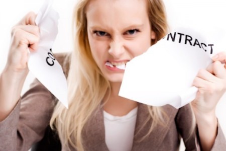 Angry woman breaking a contract