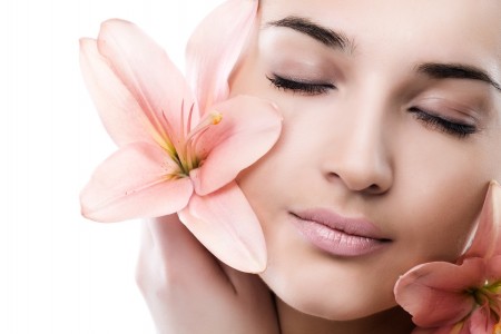 Portrait of Fresh and Beautiful woman with flower isolated on white